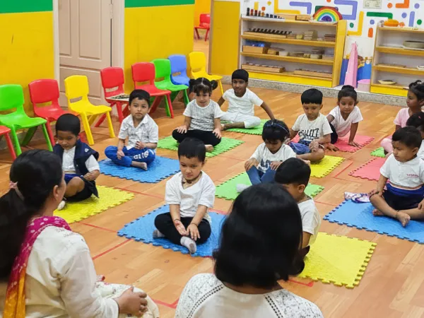 Little Ville children during group circle time and morning activities